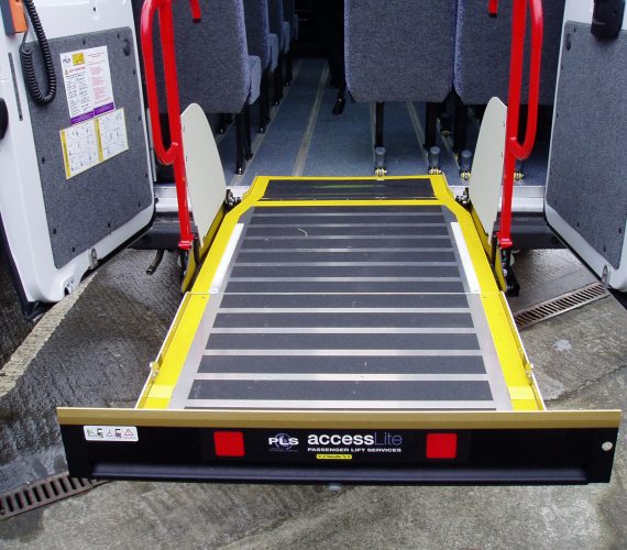 picture showing a tail lift into a vehicle. All our vehicle have accessibility features such as this.